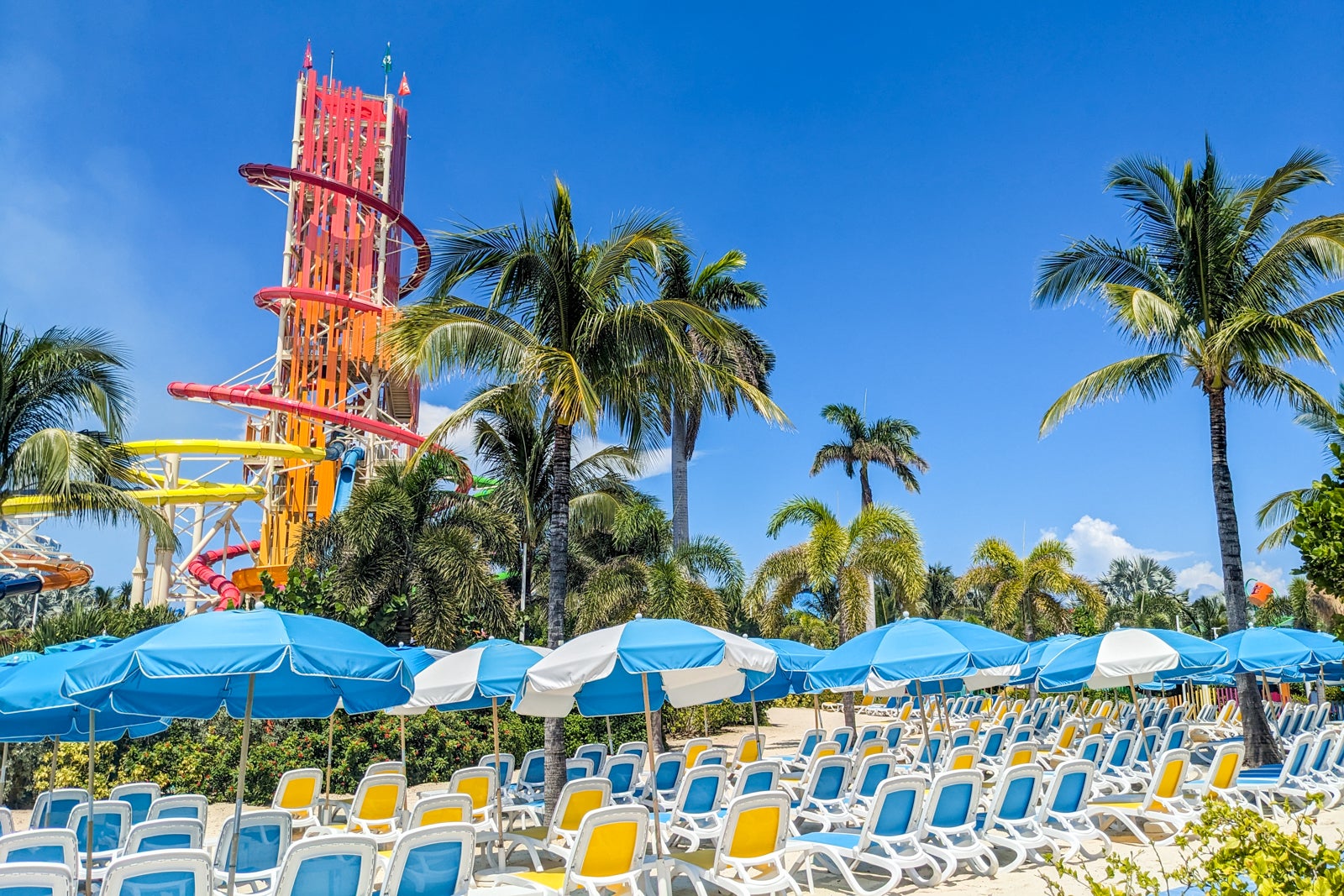Waterslide tower above beach chairs at Perfect Day at CocoCay.