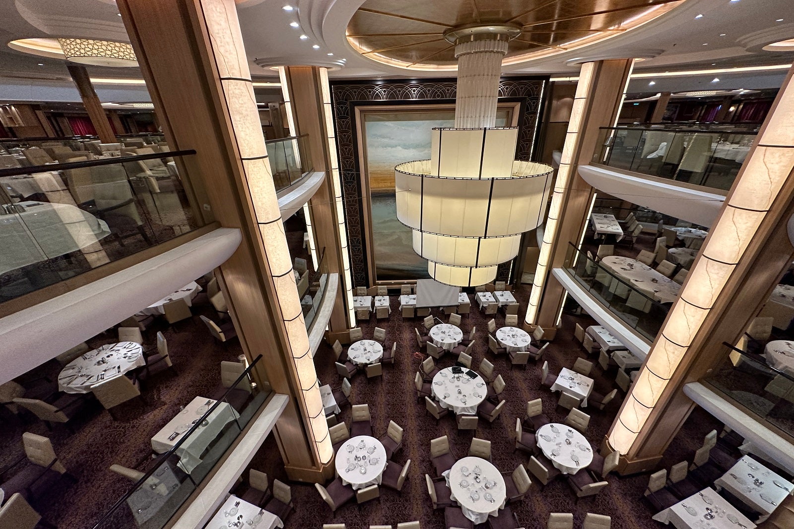 An aerial view of a three-deck cruise ship dining room