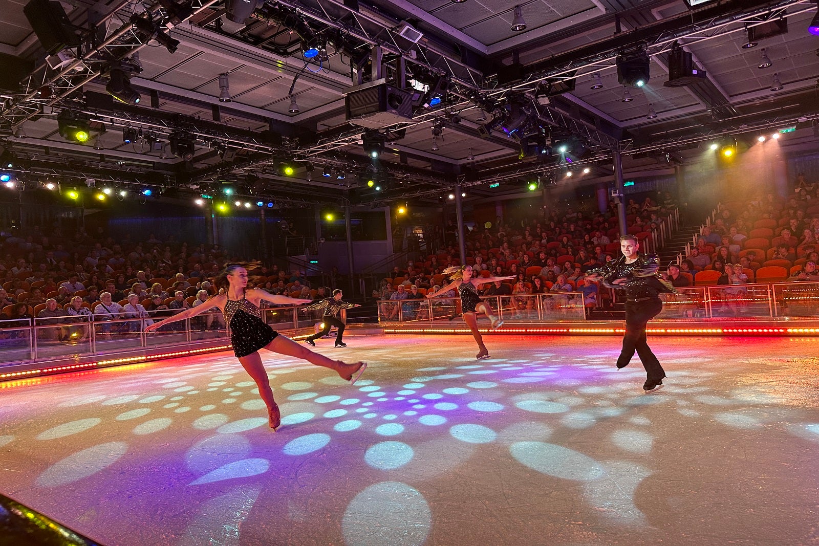 Ice dancers performing during an ice show on a cruise ship