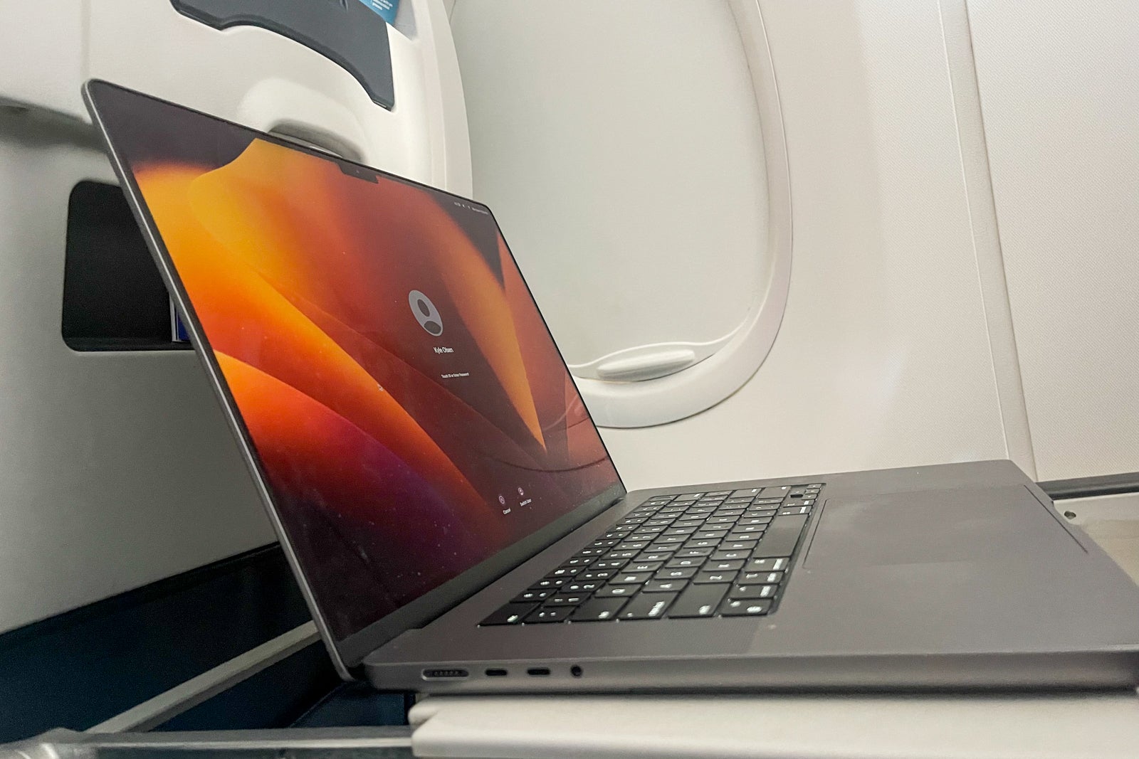 Laptop on tray table United Boeing 737 MAX 9