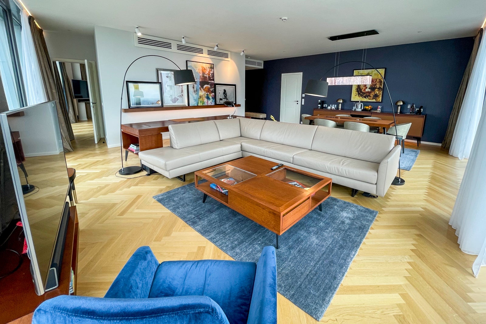 L-shaped sofa, coffee table and chair in the Andaz Vienna Executive Suite