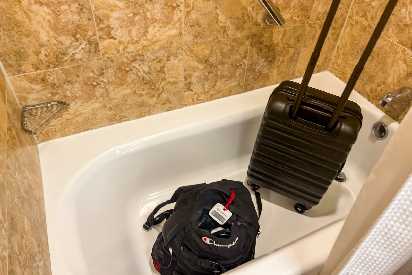 suitcase in bathtub