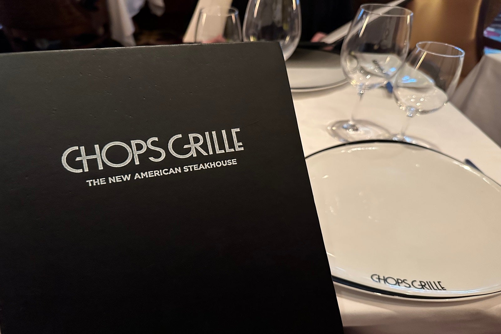 A menu and table at Chops Grille on Allure of the Seas