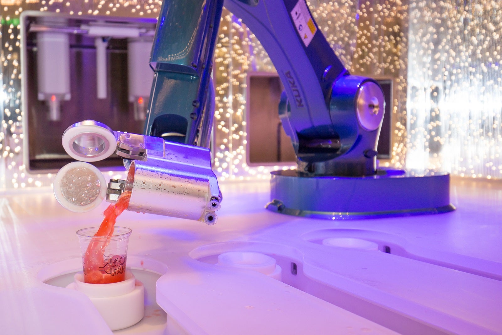 One of the Bionic Bar's robotic arms pours a drink on Harmony of the Seas