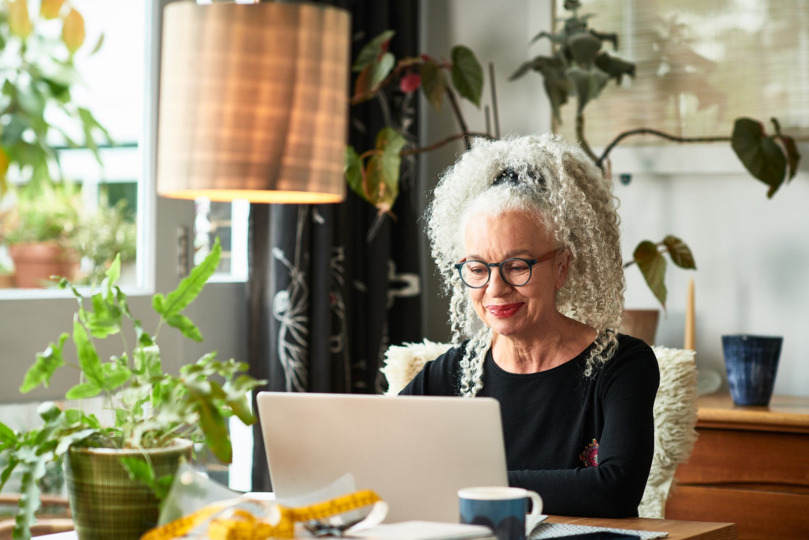 Woman using a laptop at home