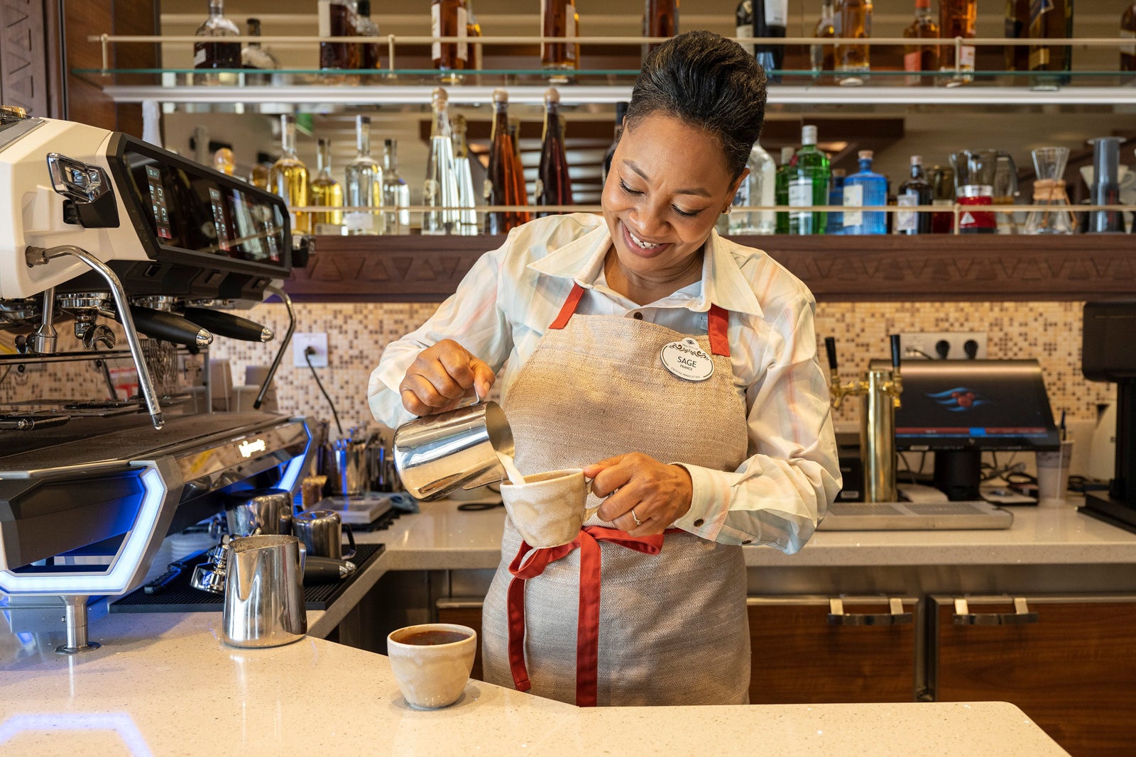 Barista making coffee drink on Disney cruise ship