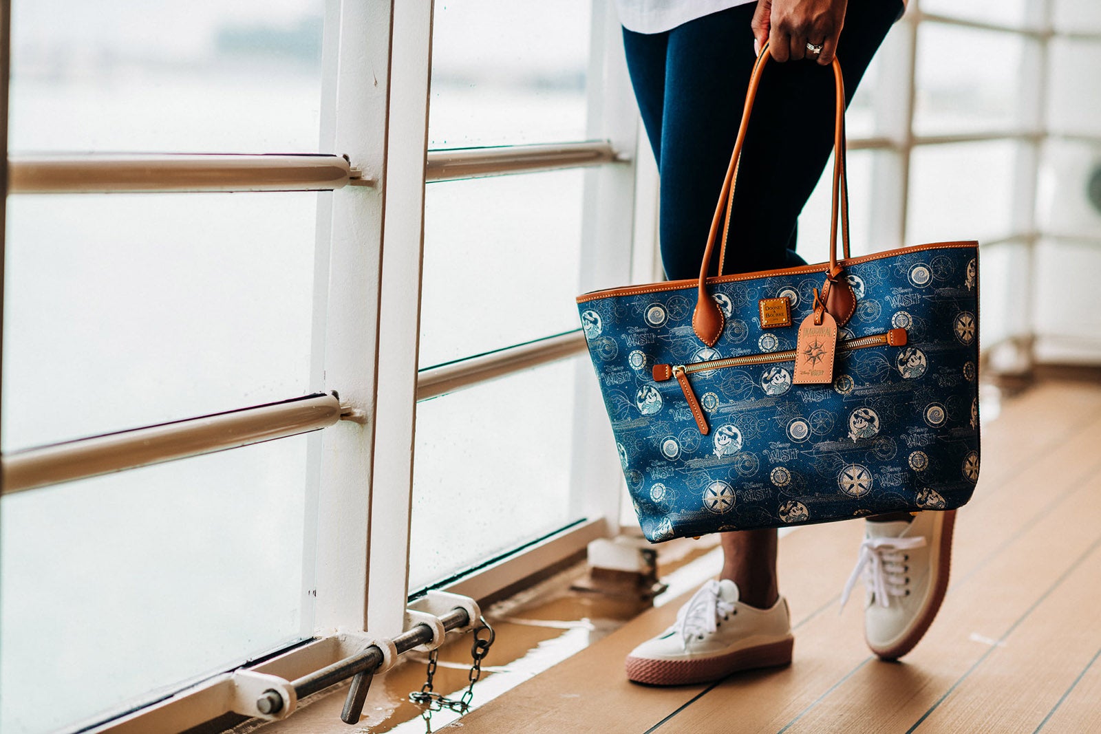 Woman with Disney themed cruise purse
