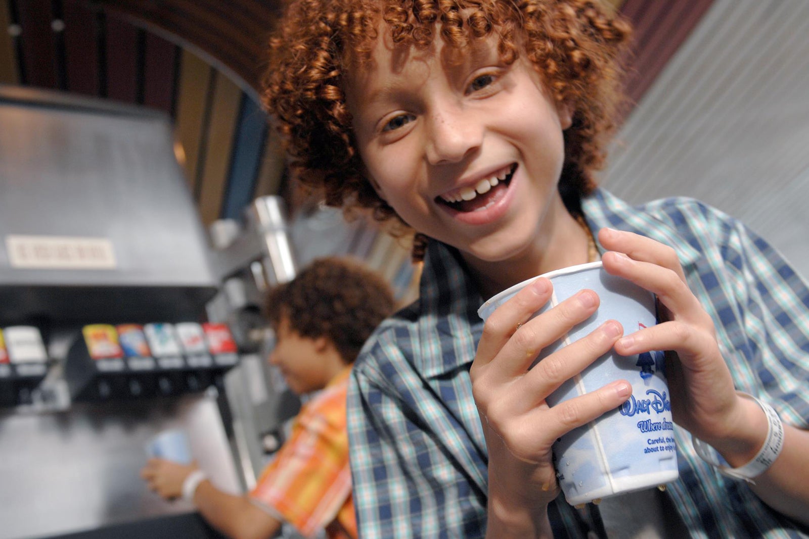 Kid drinking soda on Disney cruise