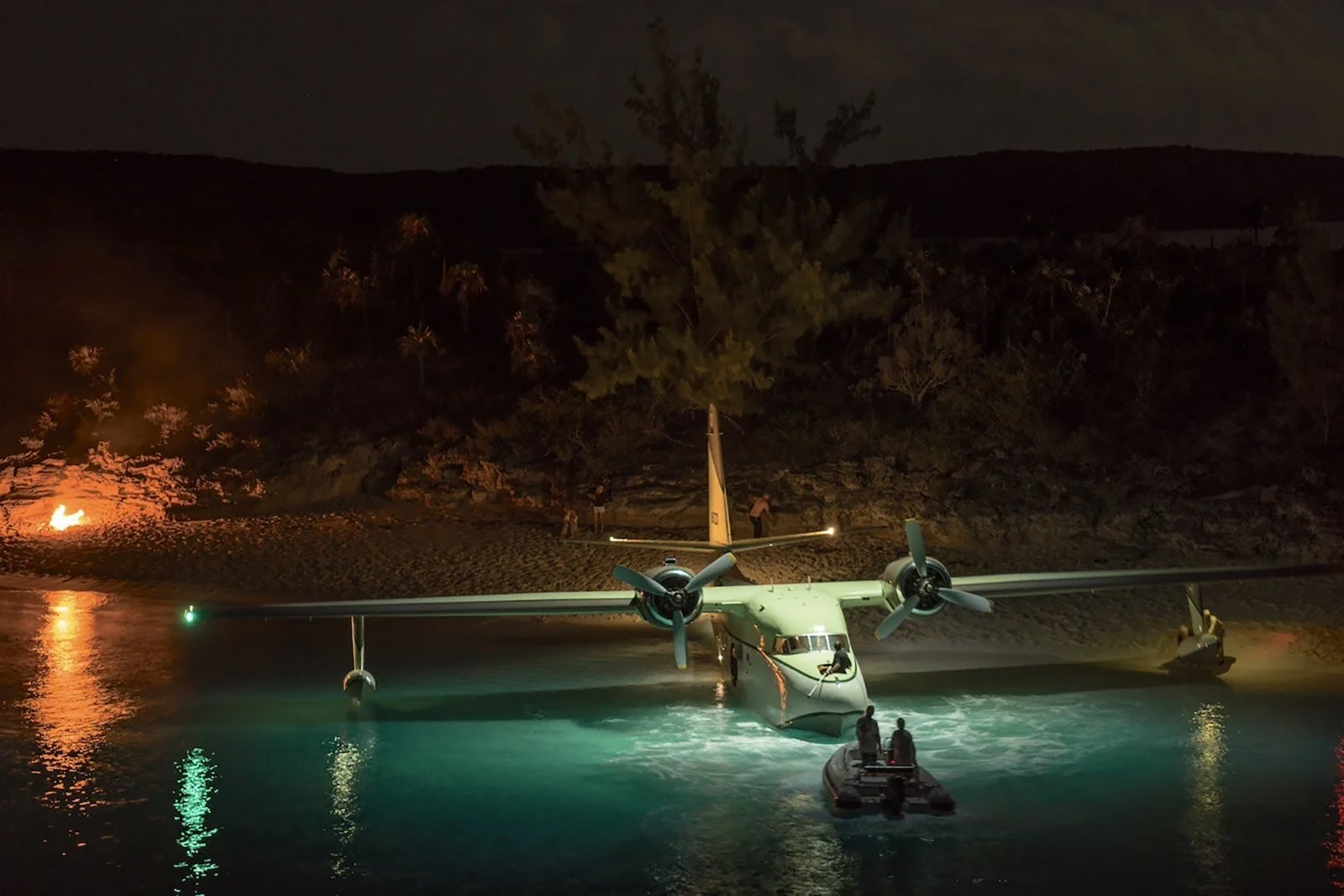 flying boat in water at night