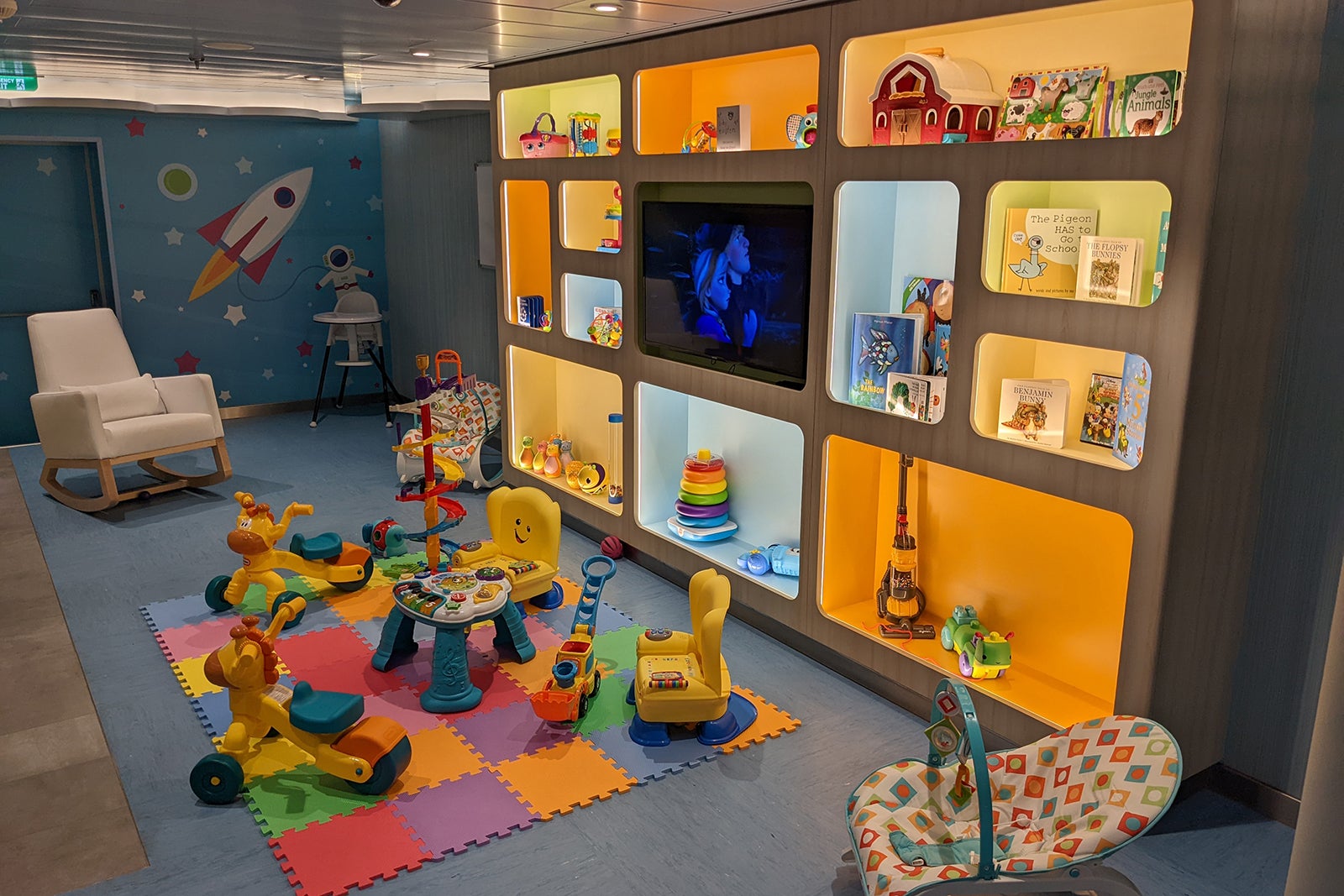 Nursery playroom with a soft mat and baby toys on Royal Caribbean cruise ship