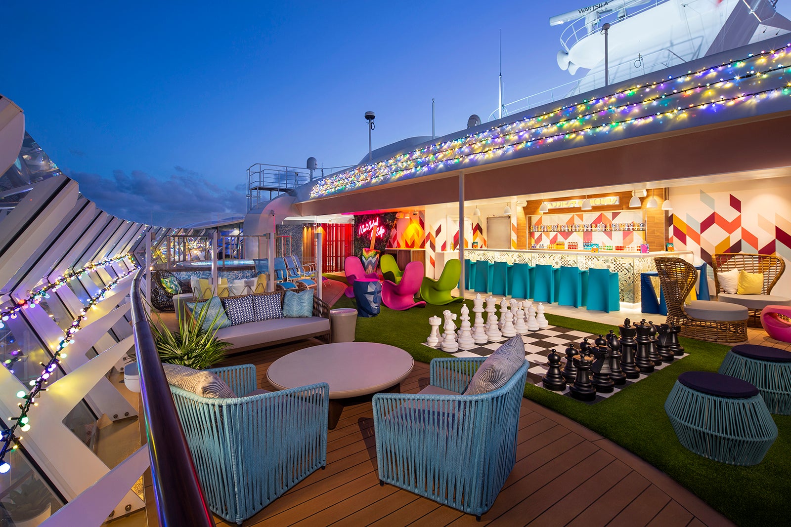 Outdoor teen hangout on a cruise ship with giant chess, mocktail bar and lounge furniture