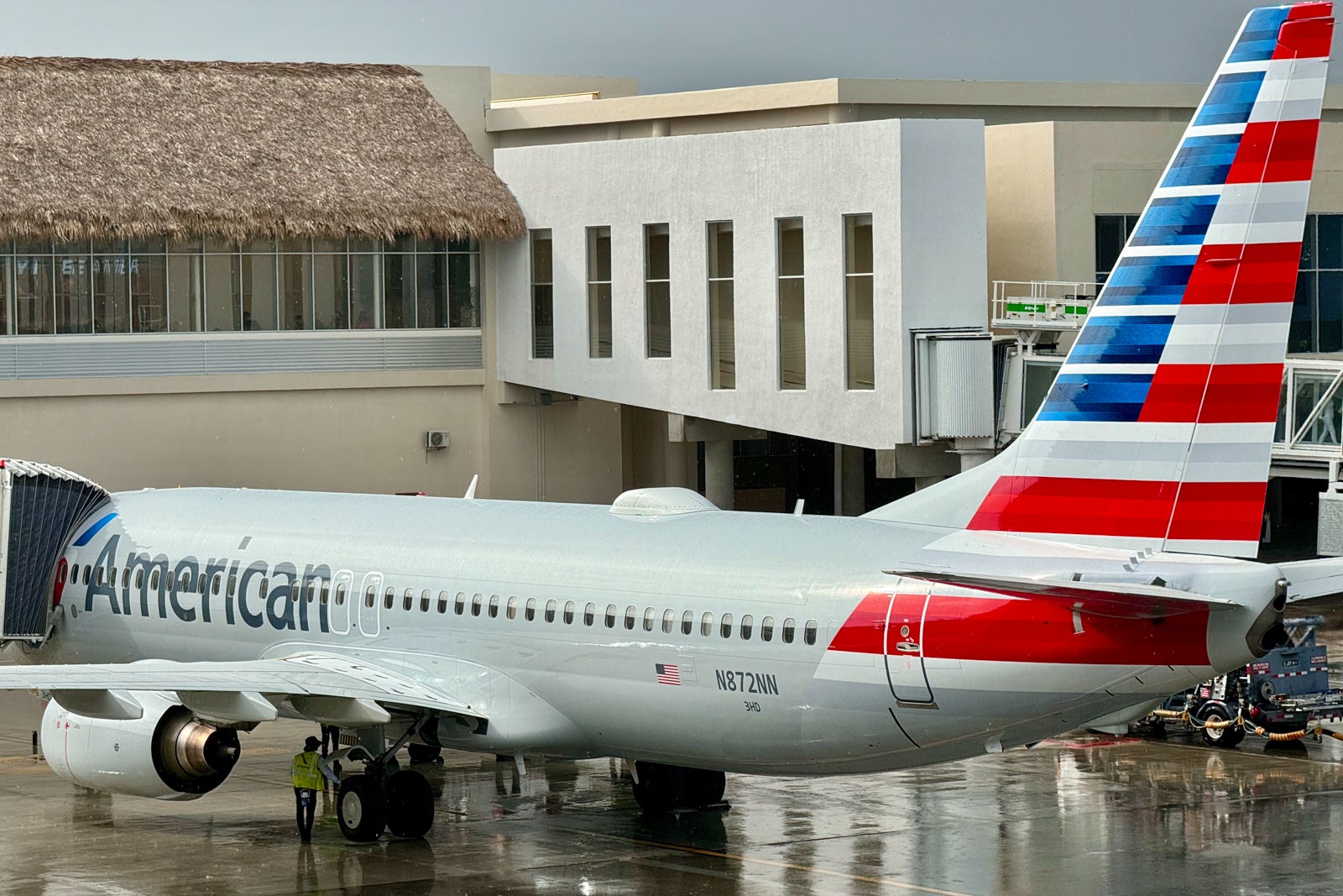 American Airlines plane at gate in the rain