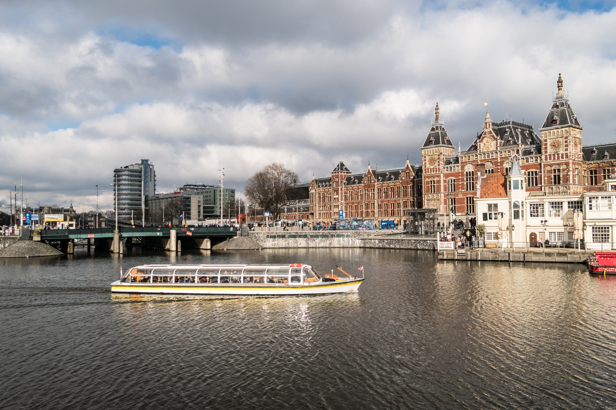 Canal cruise in front of the Centraal station in the heart of Amsterdam.