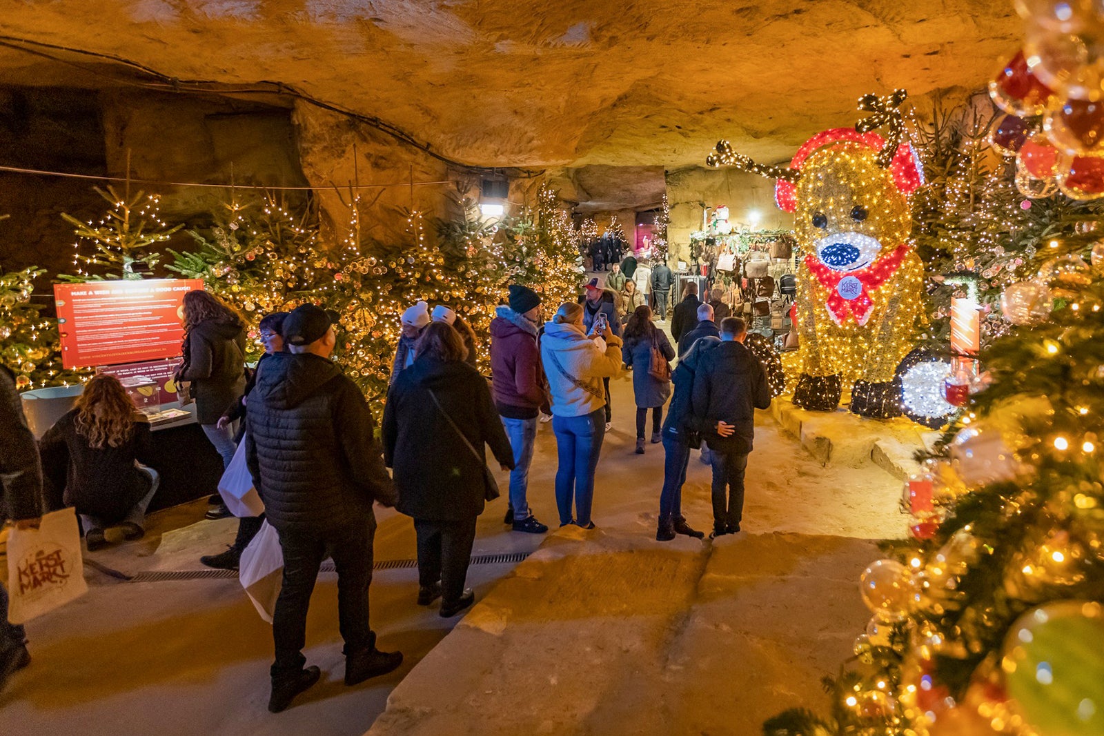 Tourists walking through Valkenburg’s underground Christmas market