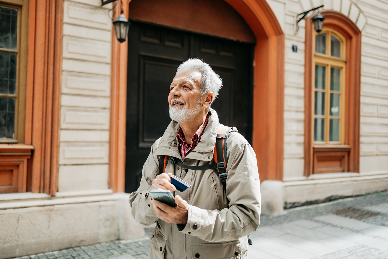 Man holding card while traveling