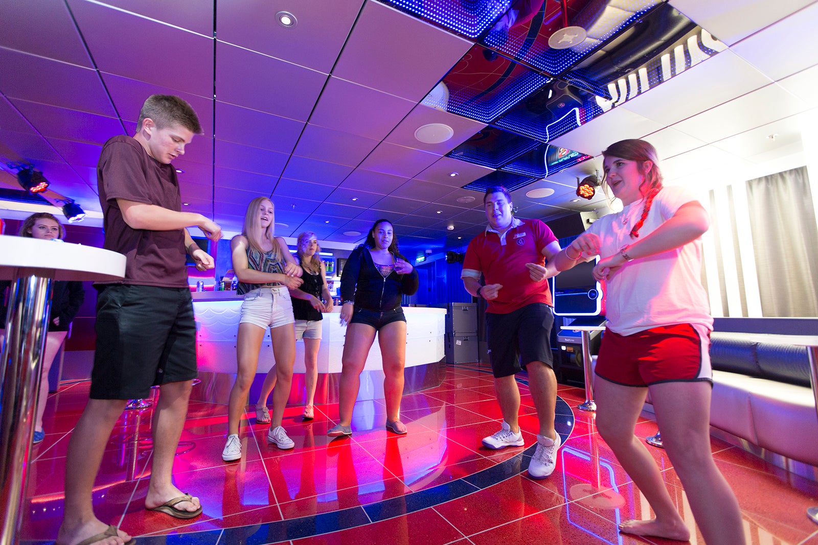Teens dancing in cruise ship teen club