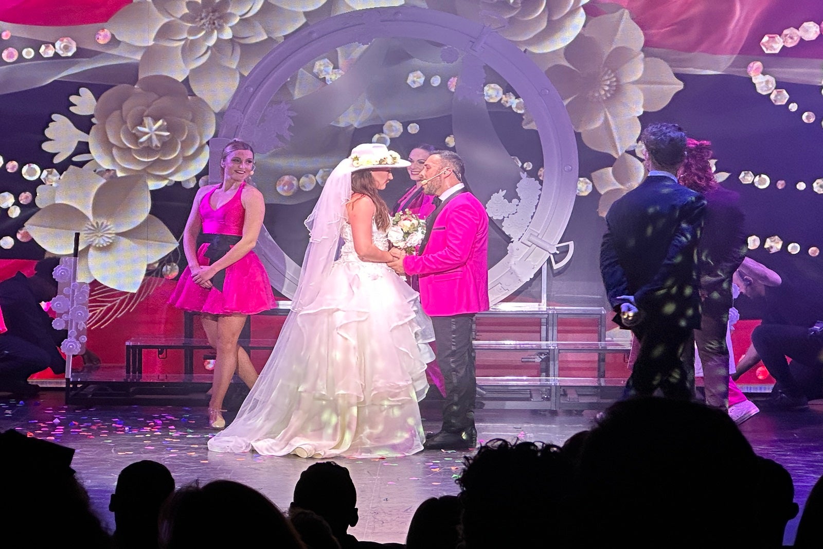 Two performers get married on stage as part of a cruise ship show
