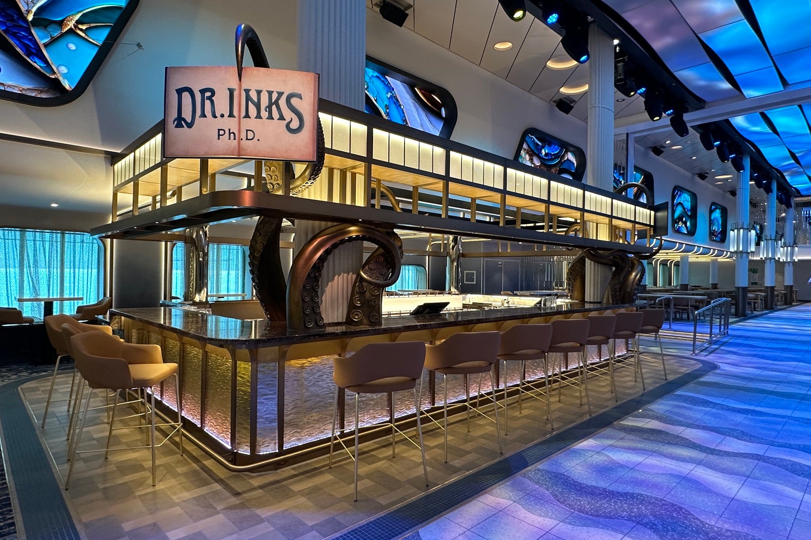 A bar with stools and a sign that reads "Dr. Inks Ph. D."
