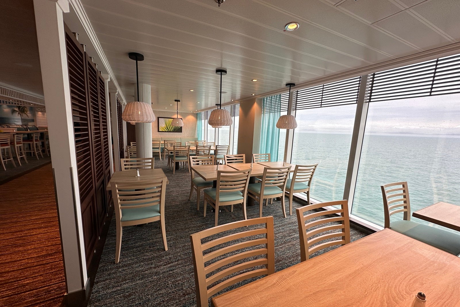 Tables and chairs in a cruise ship buffet