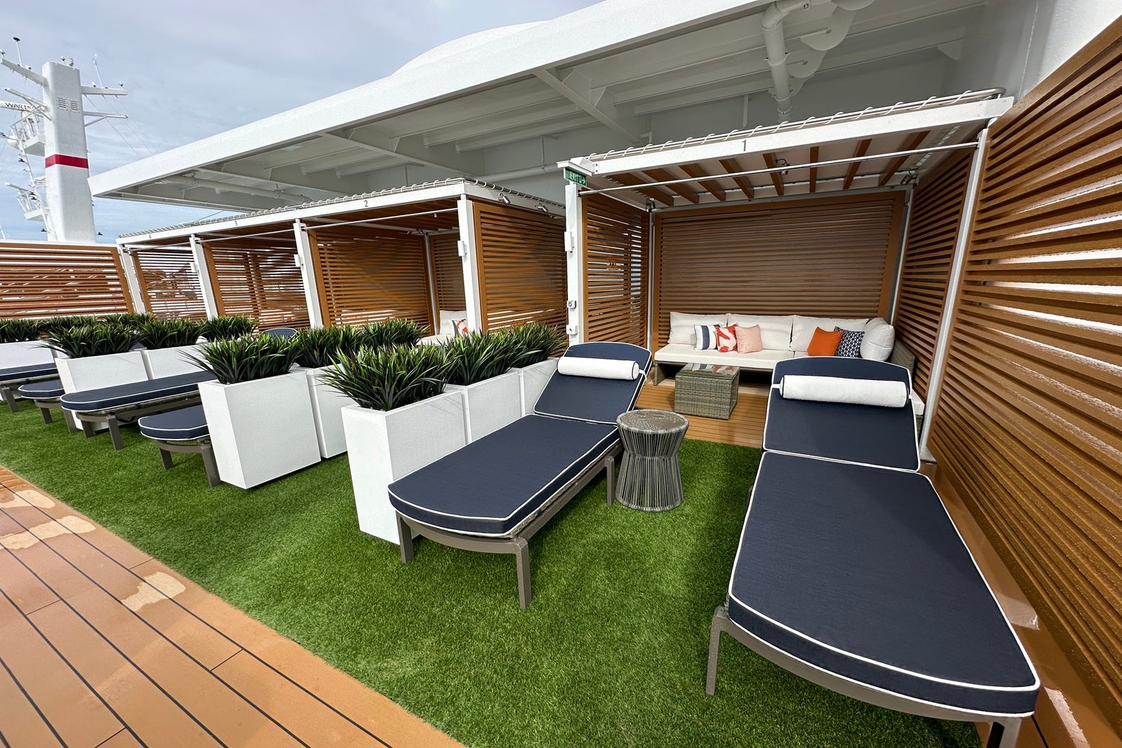 Cabanas on faux grass on a private cruise ship sun deck