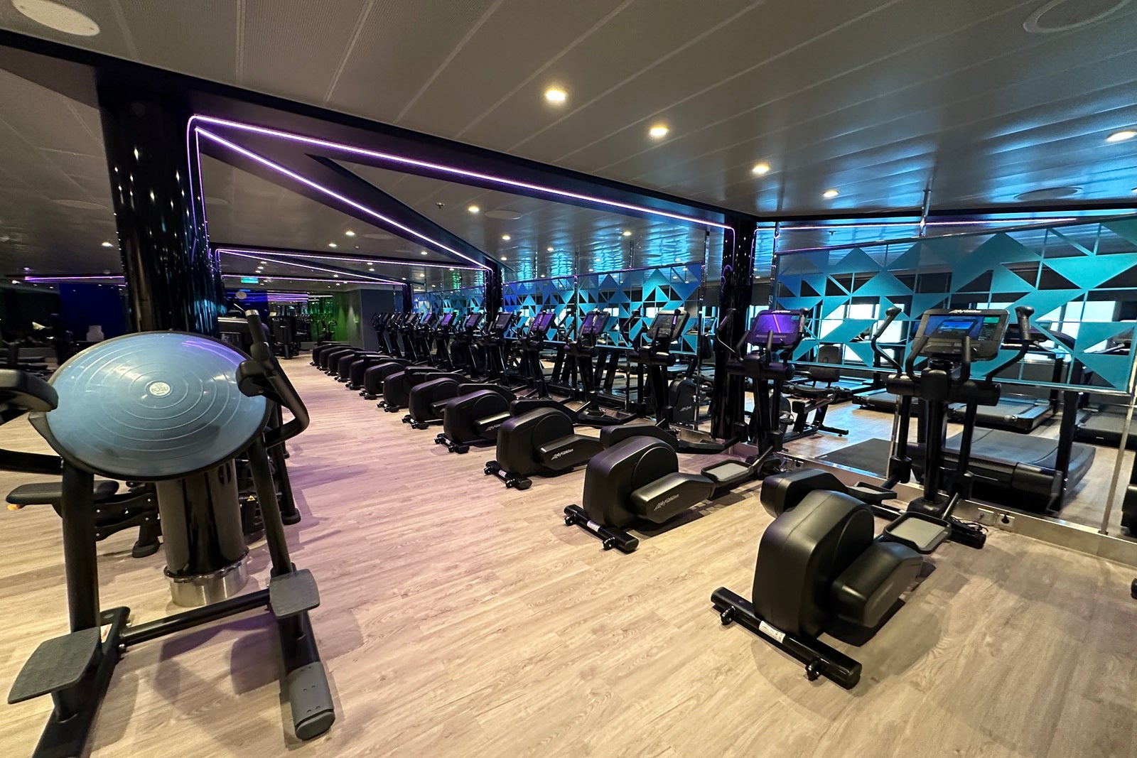 A cruise ship fitness center with exercise machines