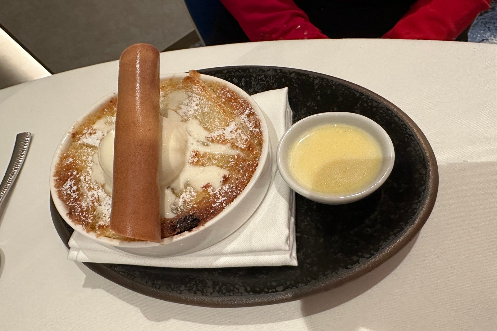 A bread pudding dessert with ice cream