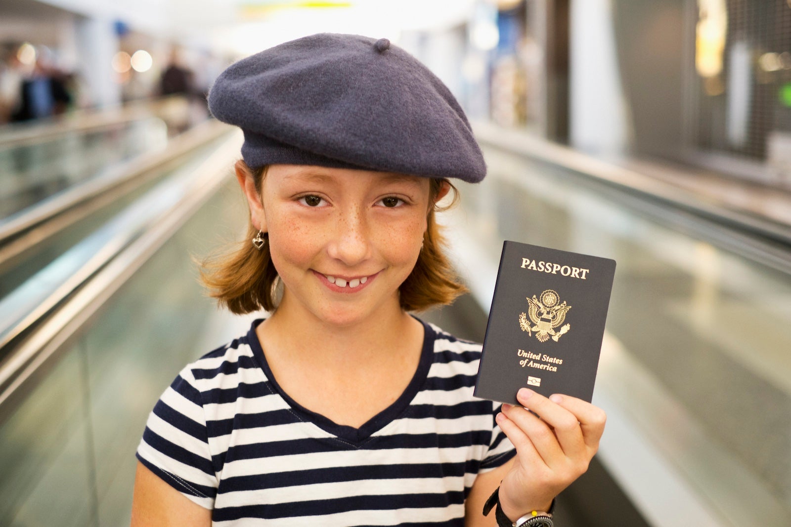 child holding passport