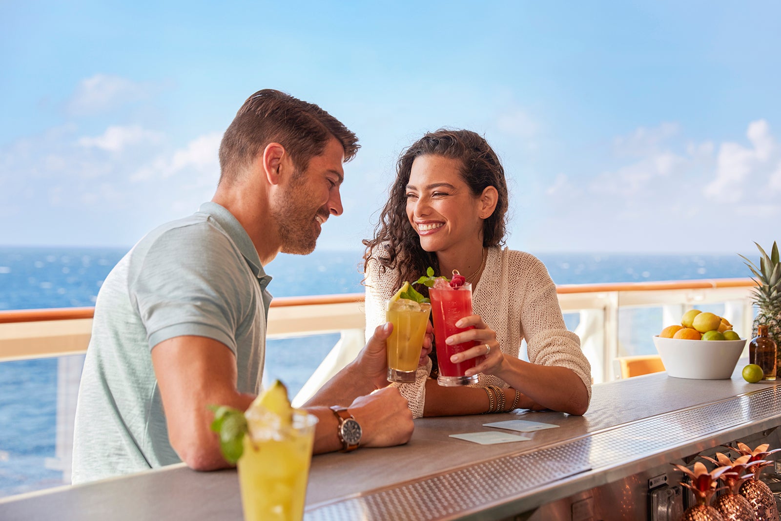 A couple at a bar on a Norwegian Cruise Line ship