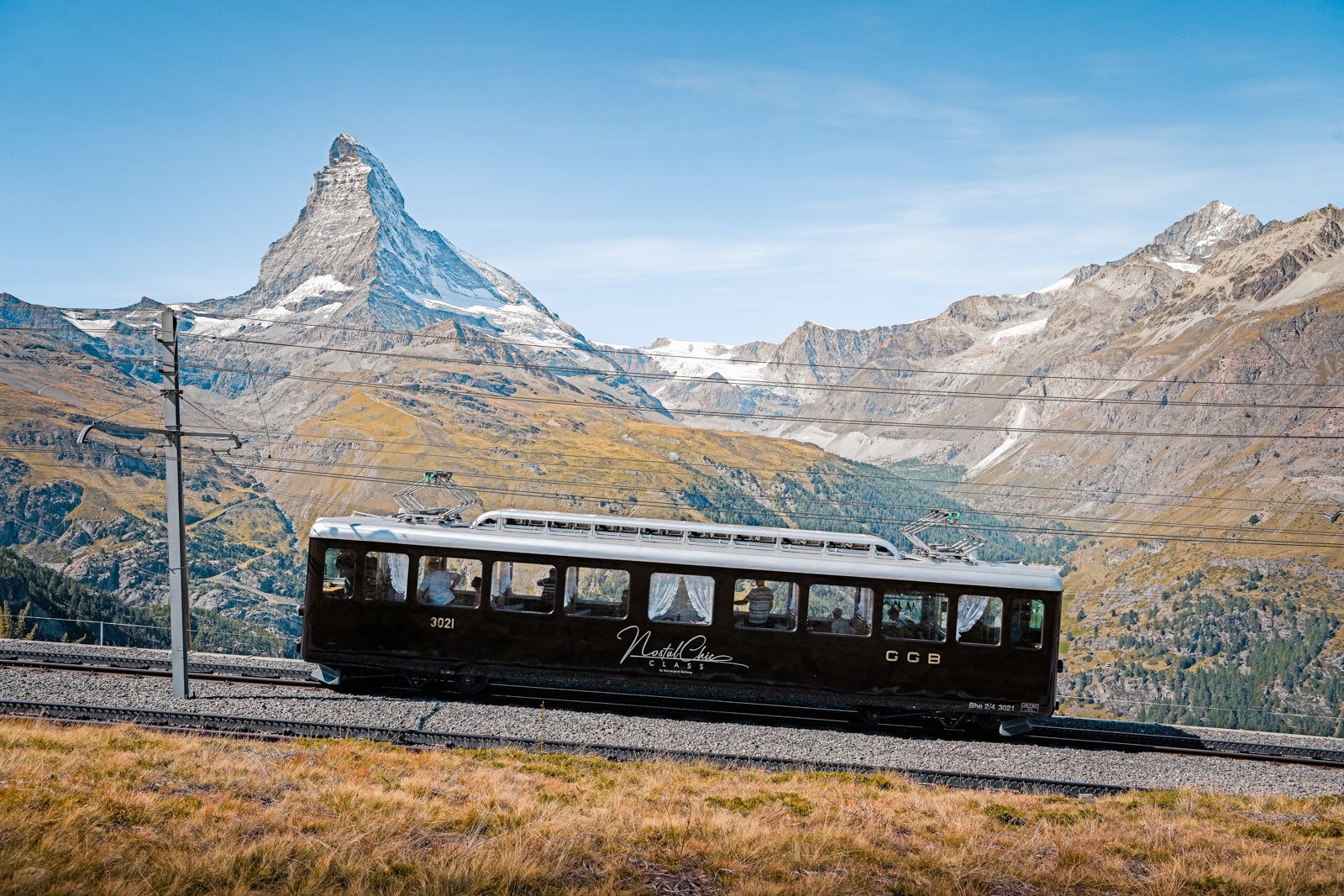 NostalChic train traveling through mountains