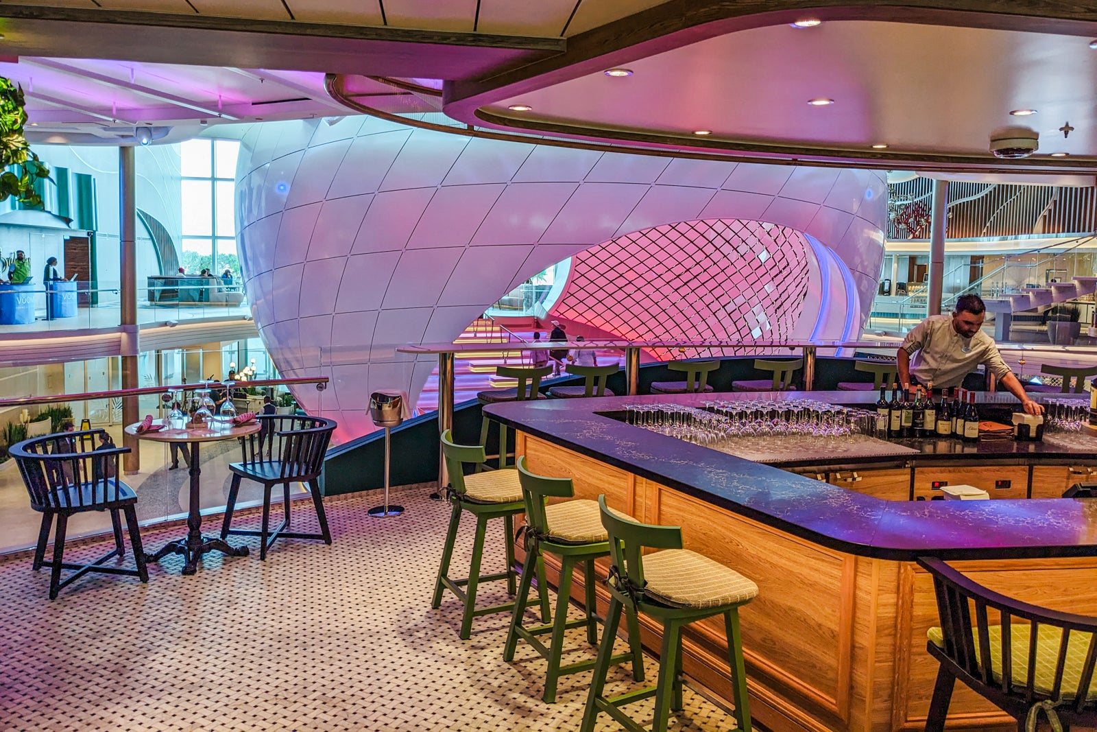 Bar overlooking The Pearl on Icon of the Seas' Royal Promenade