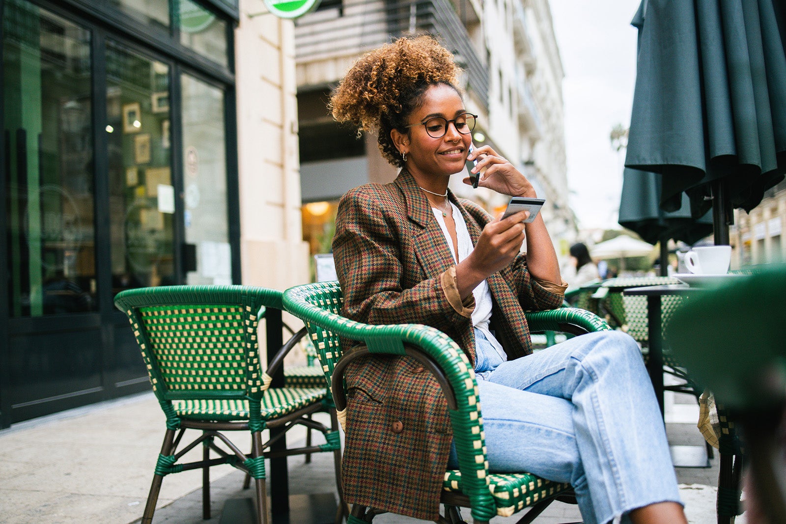 Woman talking on her phone at a cafe