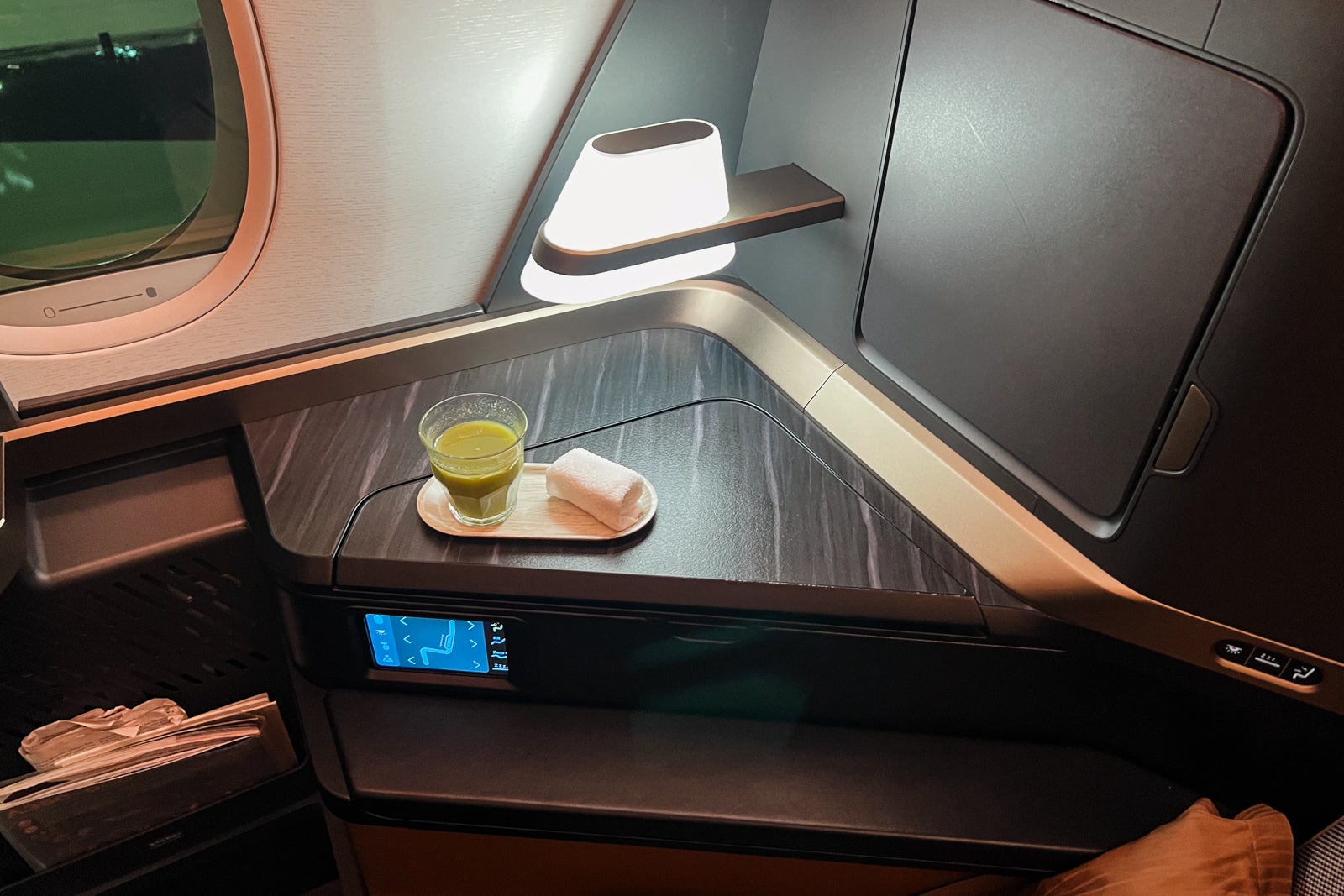 Dimmable lamp at a Starlux business class seat. 