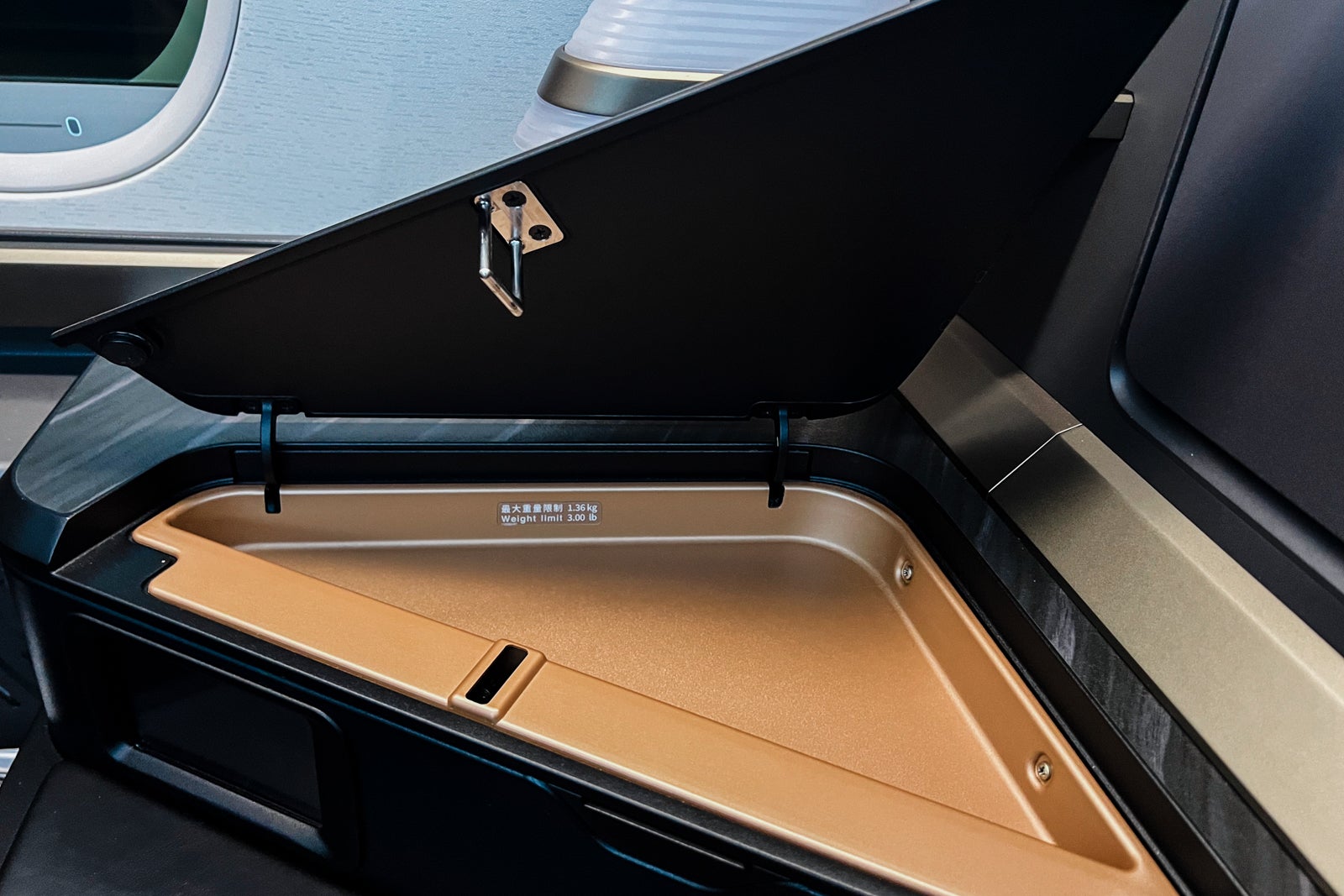 Storage compartment on Starlux A350 business class seat. 