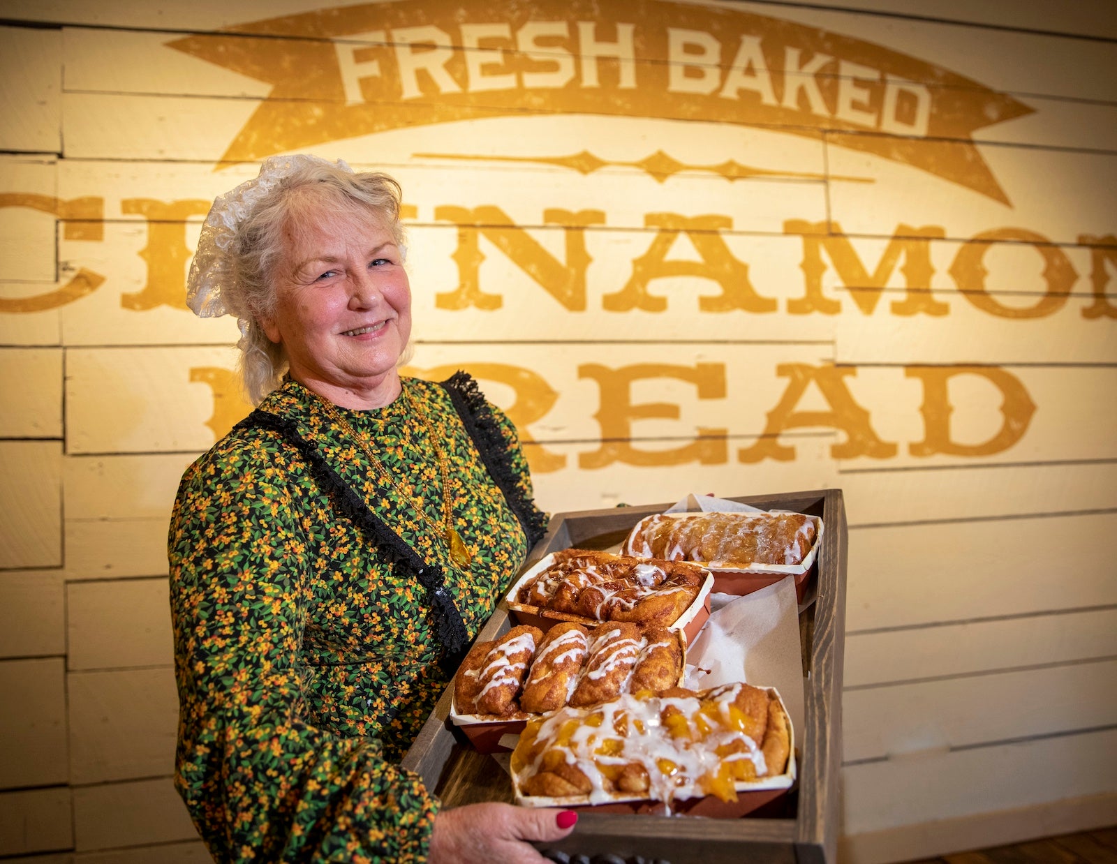 Woman holding cinnamon bread