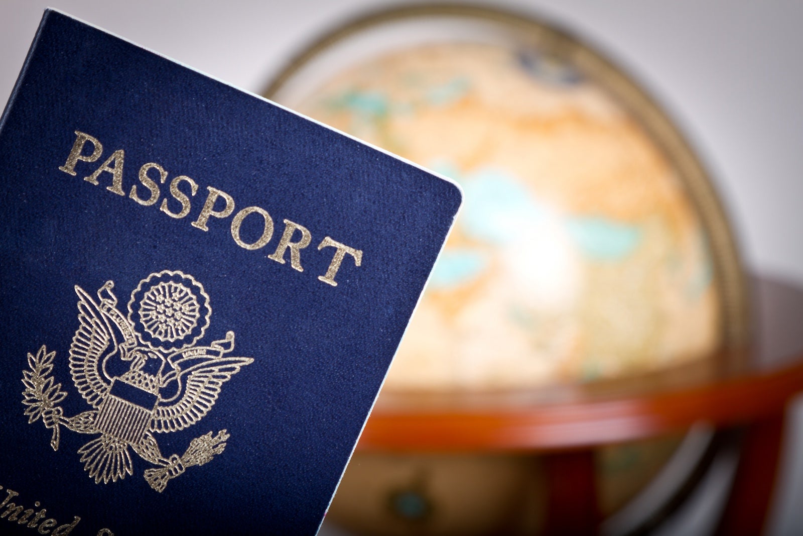 U.S. passport in front of a globe