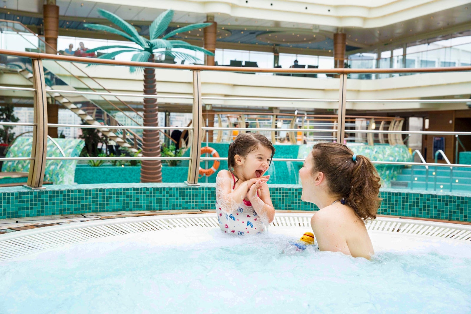 Woman with toddler in cruise ship pool