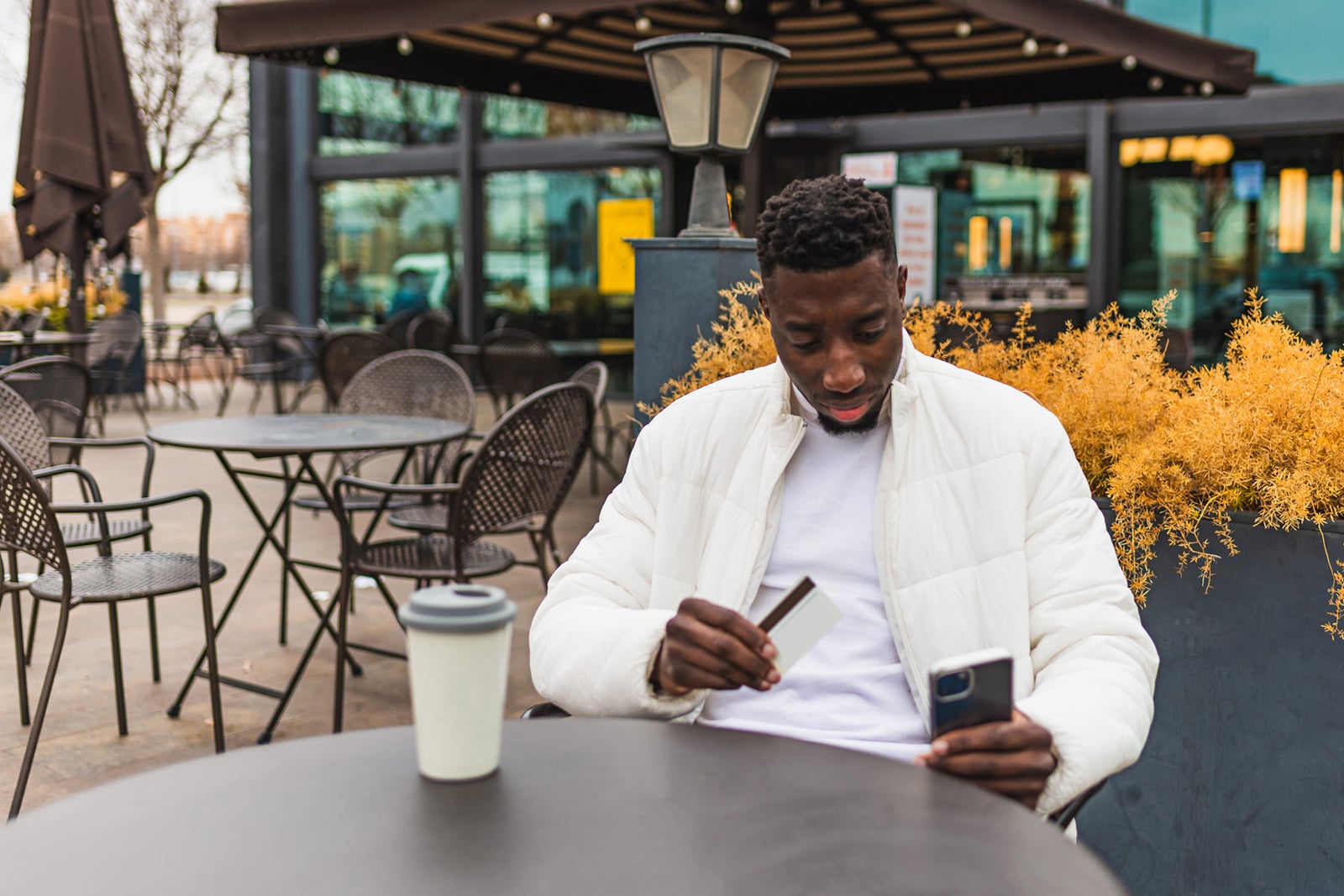 Man with credit card at table