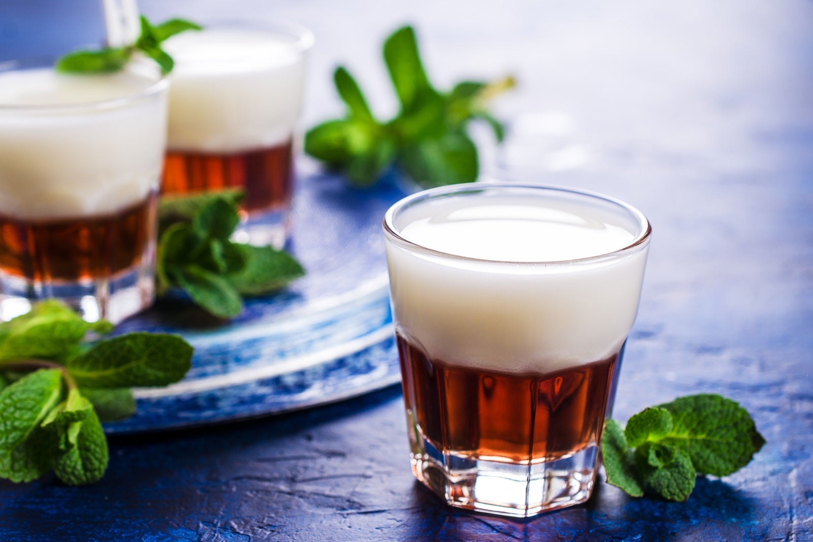 Rumchata drinks surrounded by green mint garnishes