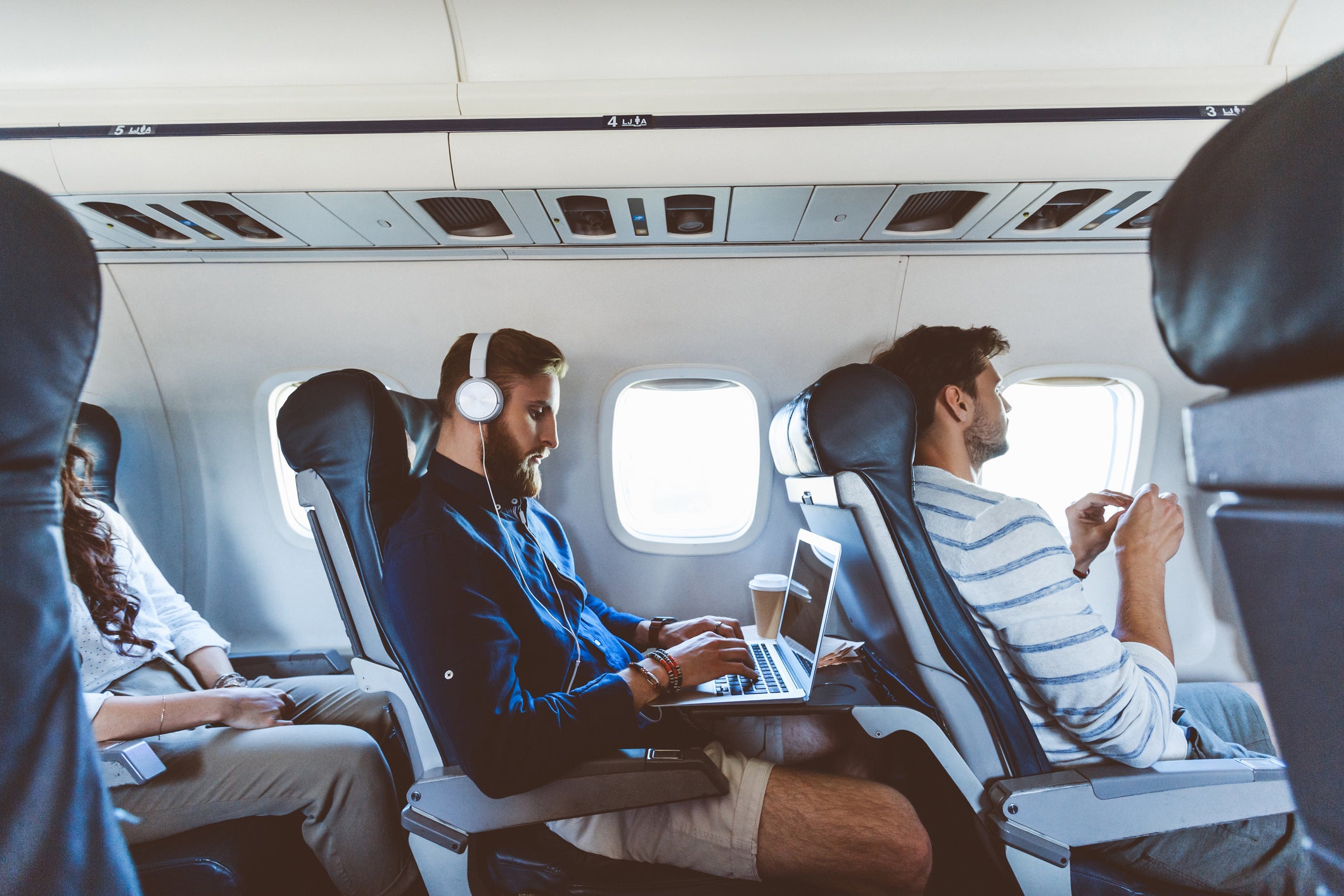 Man-using-laptop-during-flight