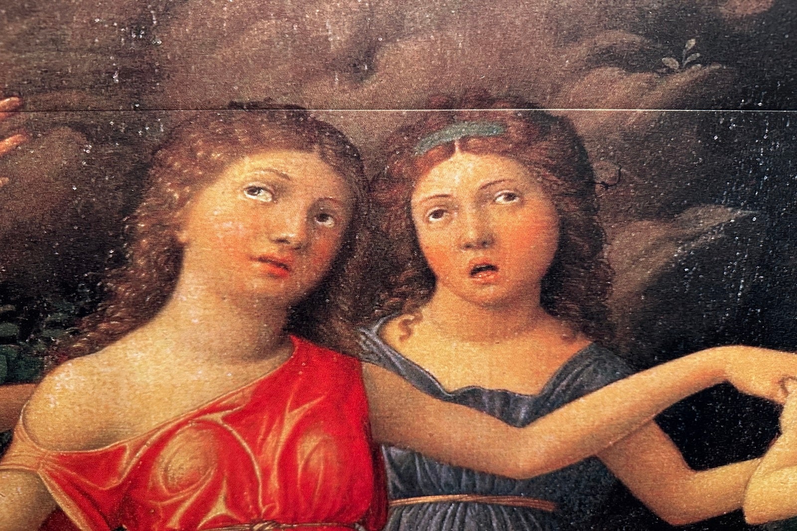Two confused looking women in part of a painting