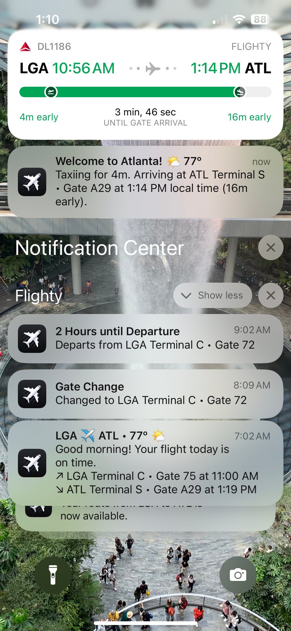 Flighty notifications for an Atlanta-bound flight from JFK.