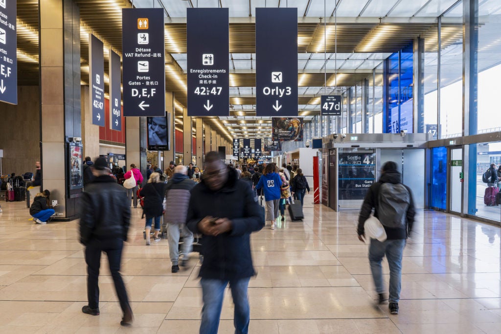 Passengers in the departures hall at Paris-Orly Airport