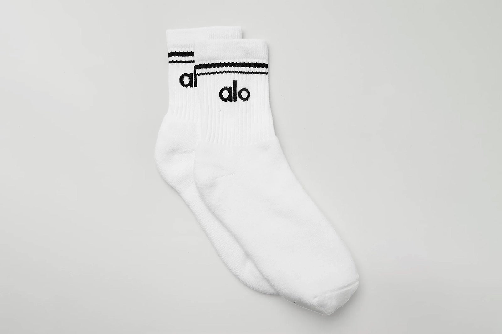 white crew socks with a black Alo logo