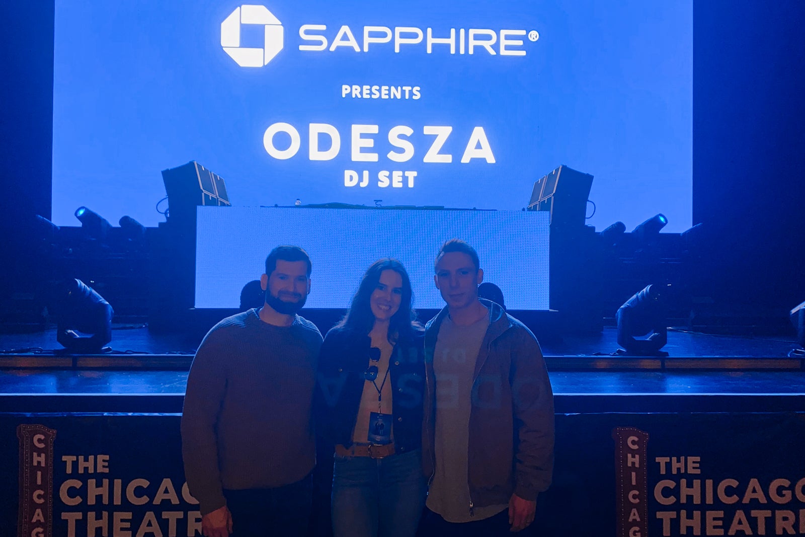 Three concert goers, including writer Caroline Tanner, in front of the Chase Sapphire stage