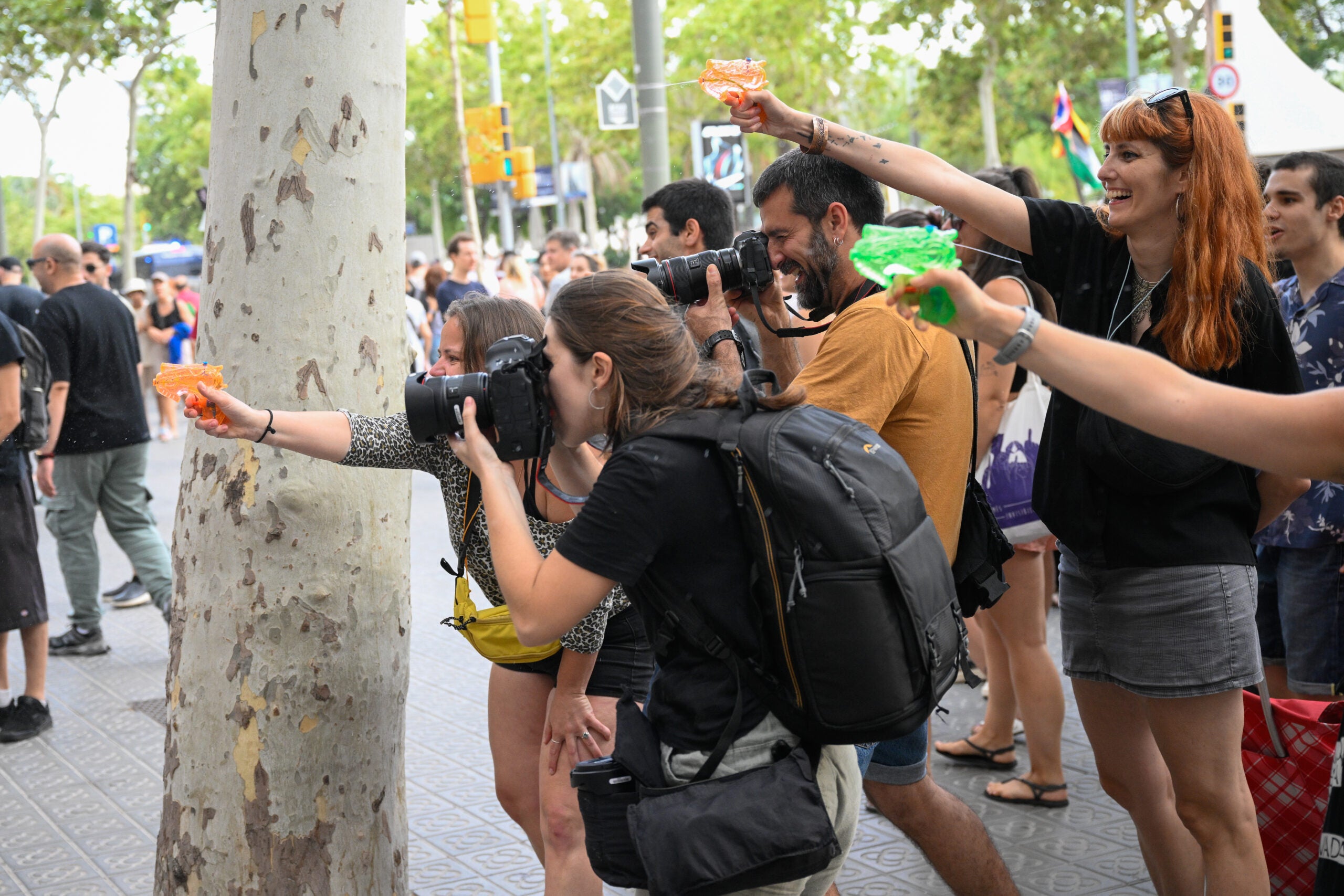 Protestors spraying tourists with water at a restaurant in Barcelona