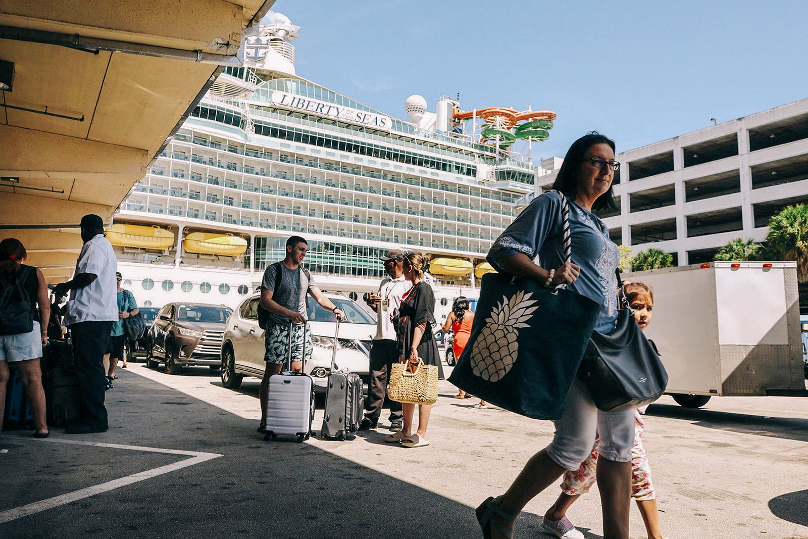 Passengers wait to board Royal Caribbean’s Liberty of the Seas at Port Everglades. 