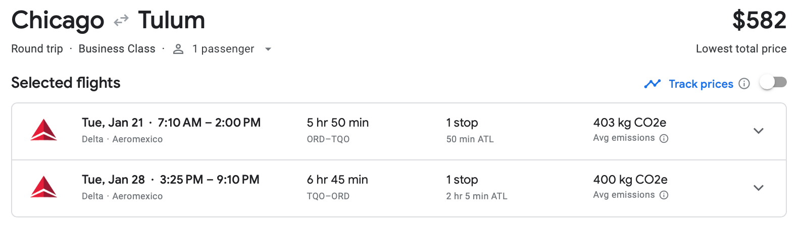 A screenshot of the Google Flights estimate for a round-trip, business class flight from Chicago to Tulum.
