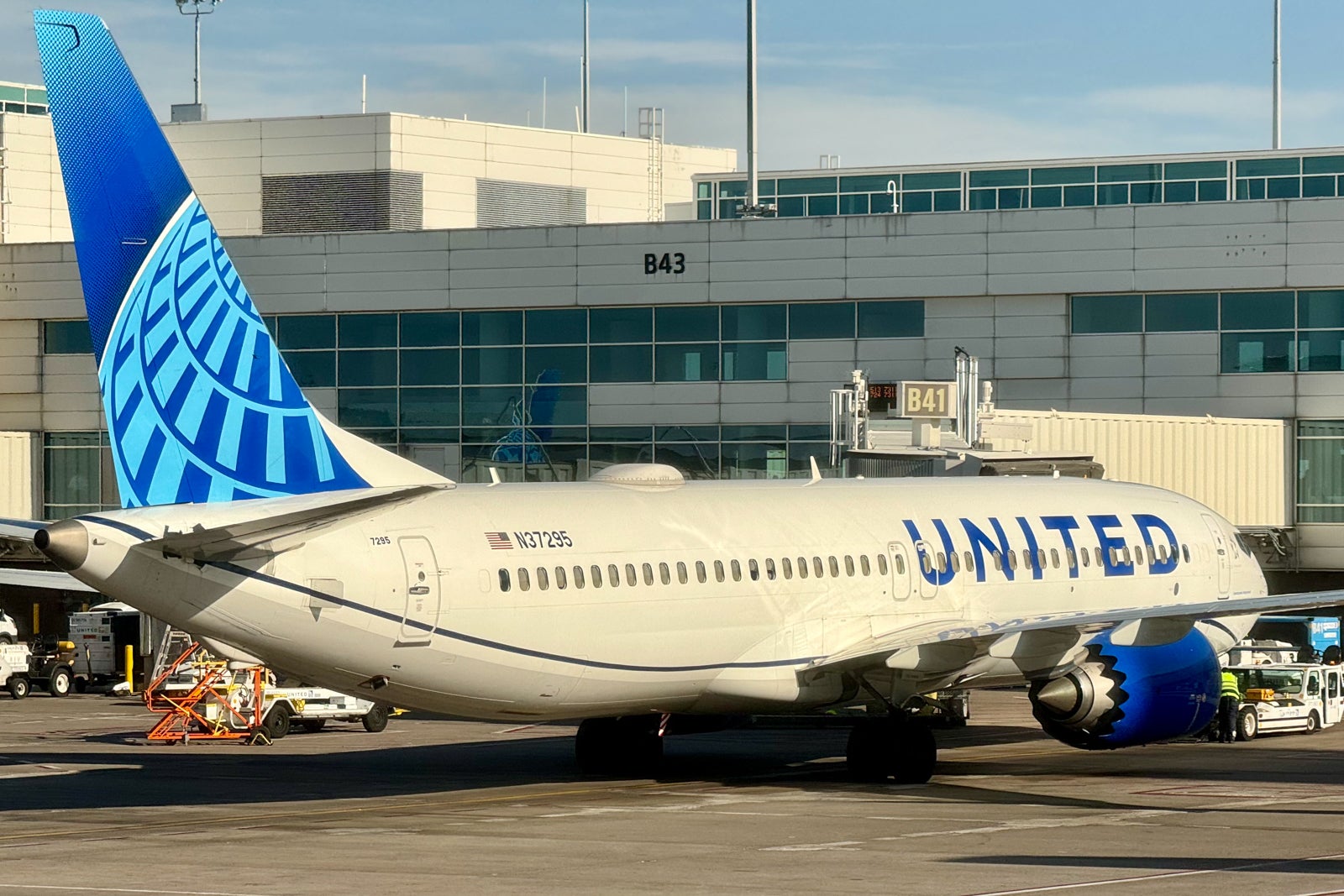 A United Boeing parked at an airport gate