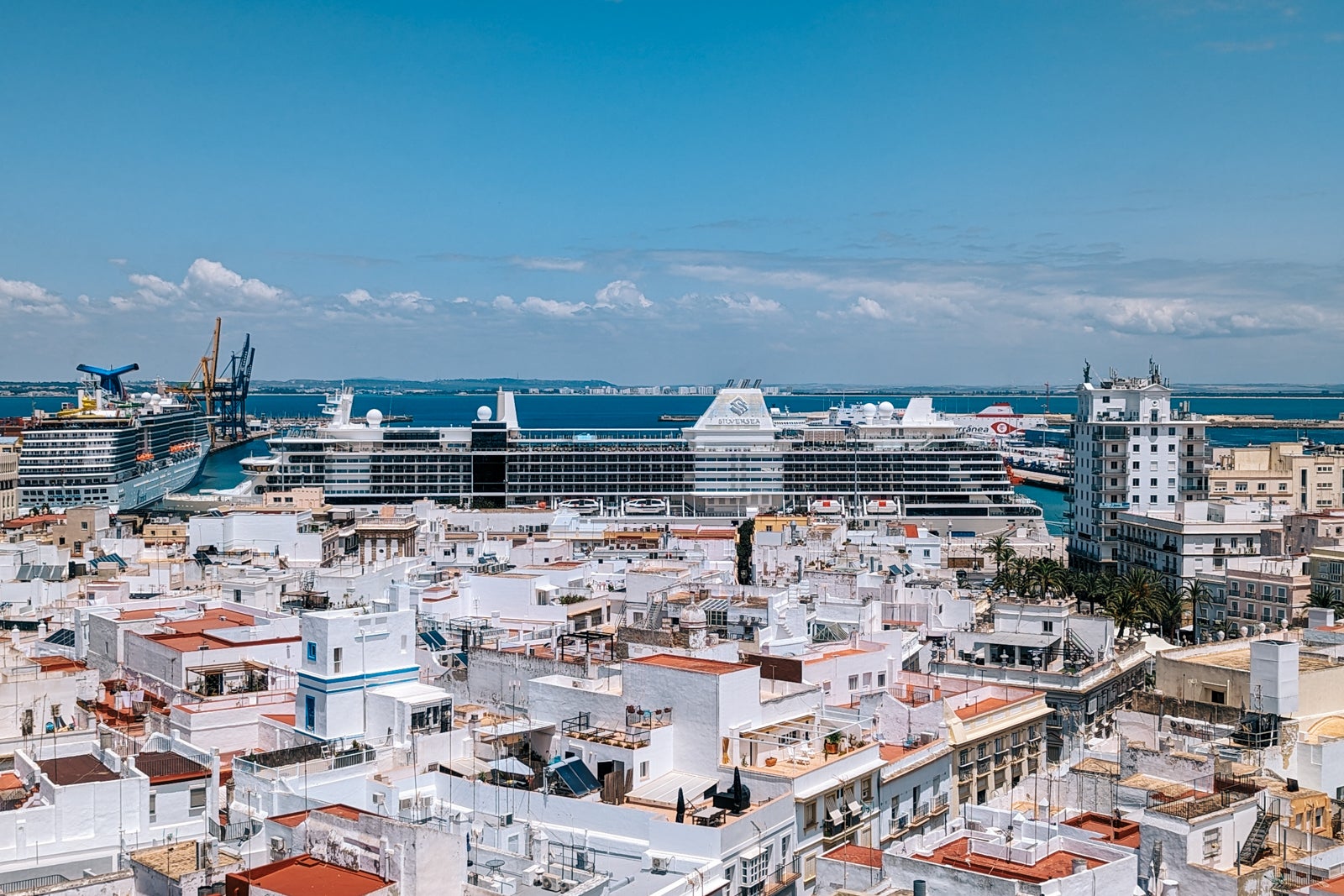 Buildings of Cadiz, Spain, with cruise ship in the background.