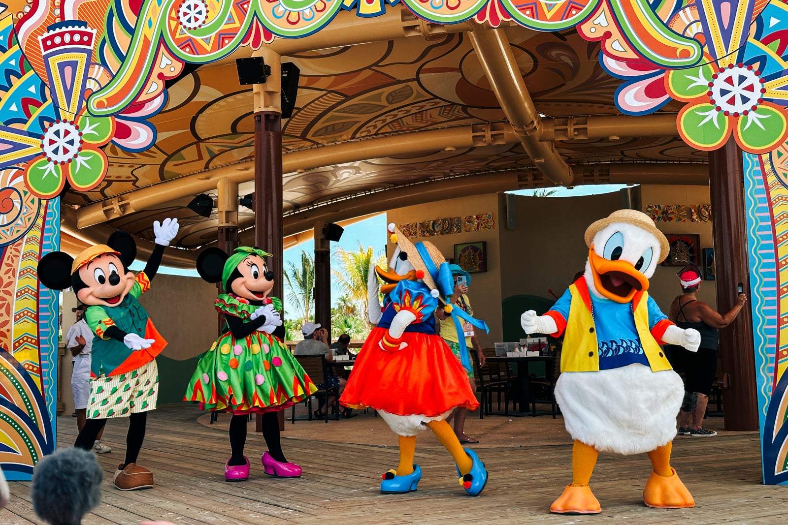 Mickey, Minnie, Donald and Daisy on a stage